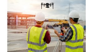 Drone pilots at work site.