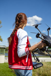 Woman holding a drone