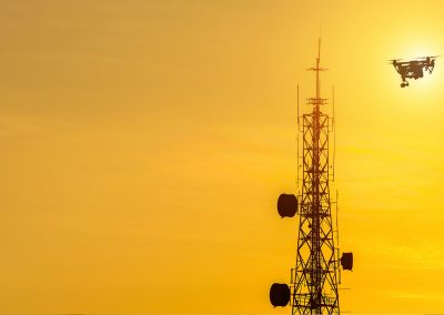 Drone Flying Near Transmission Tower